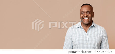 Portrait of middle aged african american man with happy smile, orange background Portrait of middle aged african american man with happy smile, orange background 134068297