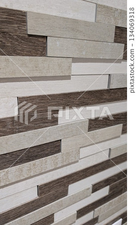 Stacked rectangular tiles in earthy tones with textured surfaces Stacked rectangular tiles in earthy tones with textured surfaces 134069318
