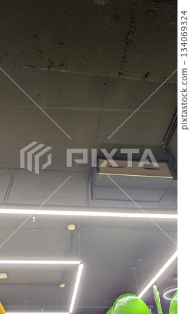 Contemporary interior highlighting ventilation and lighting features Contemporary interior highlighting ventilation and lighting features 134069324