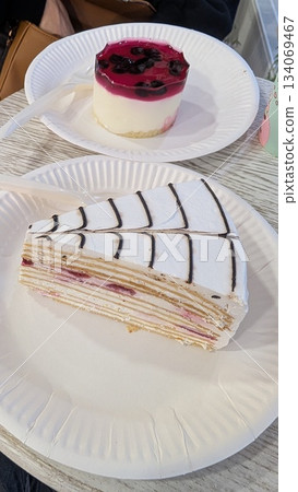 Elegant crepe dessert featuring raspberry mousse and chocolate decorations Elegant crepe dessert featuring raspberry mousse and chocolate decorations 134069467