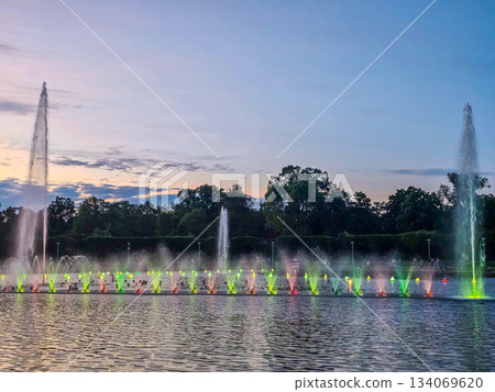 Sunset Serenity Fountain Silhouette Against Golden Sky Sunset Serenity Fountain Silhouette Against Golden Sky 134069620