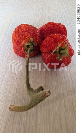 detailed examination of tomato surfaces, highresolution image capturing wrinkles and pores detailed examination of tomato surfaces, highresolution image capturing wrinkles and pores 134069629