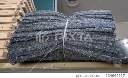 Industrial scene with tied recycled denim for building purposes Industrial scene with tied recycled denim for building purposes 134069637