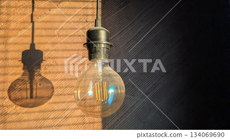 warm glow accents textured wall, ambient vintage ambiance with shadow play and warm highlights 134069690