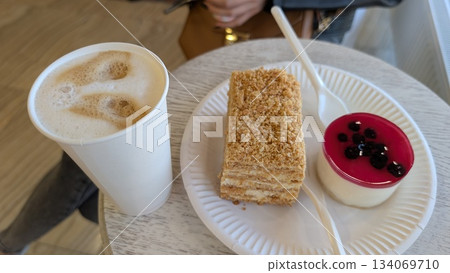 gourmet dessert presentation, elegant layered cake with berries, delicious pastry with cream 134069710