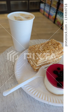 warm beverage paired with sweet treat, relaxing scene featuring dessert and comforting atmosphere 134069718