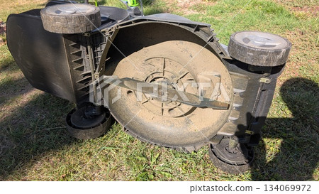 The Mower Base on Grass Requires Maintenance or Possibly a Repair Work to Be Done Soon The Mower Base on Grass Requires Maintenance or Possibly a Repair Work to Be Done Soon 134069972