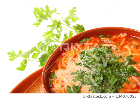 Tomato soup, parsley isolated white background Tomato soup, parsley isolated white background 134070055