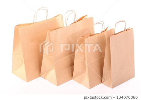 Shopping brown gift bags isolated Shopping brown gift bags isolated 134070060