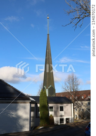 Modern church steeple against blue sky 134070172