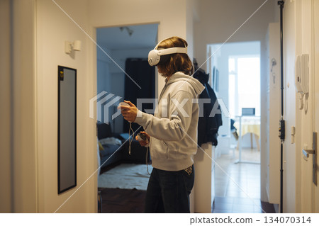 User engaged in digital environment assessment from personal workspace 134070314