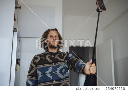 Person arranging illumination for social media tutorial shoot Person arranging illumination for social media tutorial shoot 134070330