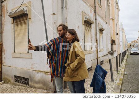 Journeyers preserve snapshots amid old structures and lively streets 134070356