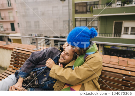 Intimate embrace with joyful partner on lively urban street 134070366