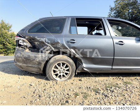 A wrecked car stands on the road. A car after an accident 134070726