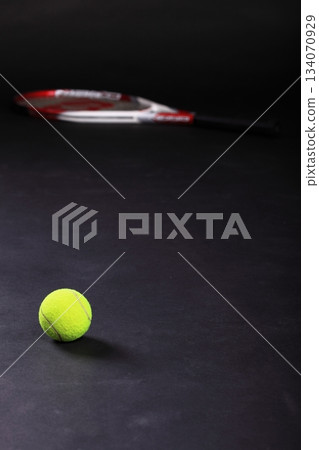 tennis racket and balls on black background tennis racket and balls on black background 134070929