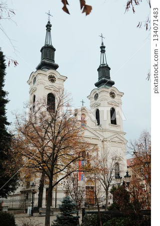 The twin towers of Saint Nicholas Cathedral rise above the central square of Sremski Karlovci, Serbia. The architecture reflects deep cultural and spiritual traditions 134071483