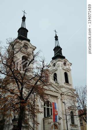 The twin towers of Saint Nicholas Cathedral rise above the central square of Sremski Karlovci, Serbia. The architecture reflects deep cultural and spiritual traditions 134071489