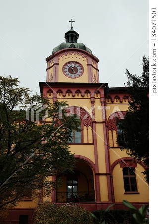 A colorful clock tower in Sremski Karlovci, Serbia, with ornate architectural details. A concept of cultural heritage and historical identity A colorful clock tower in Sremski Karlovci, Serbia, with ornate architectural details. A concept of cultural heritage and historical identity 134071501
