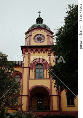 A colorful clock tower in Sremski Karlovci, Serbia, with ornate architectural details. A concept of cultural heritage and historical identity A colorful clock tower in Sremski Karlovci, Serbia, with ornate architectural details. A concept of cultural heritage and historical identity 134071503