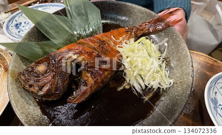 Delicious boiled golden-eyed snapper at an izakaya 134072336