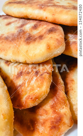 Close up of traditional homemade golden brown fried or baked savory pastries 134072480