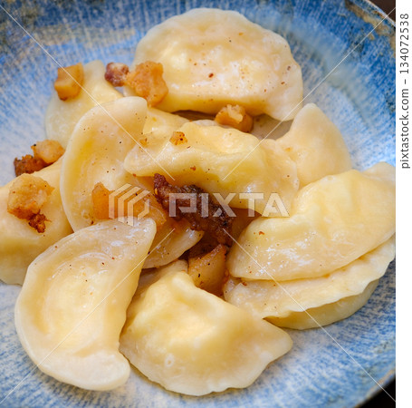 Dumplings filled with ground meat. Varenyky, vareniki, pierogi, pyrohy - dumplings with filling Dumplings filled with ground meat. Varenyky, vareniki, pierogi, pyrohy - dumplings with filling 134072538