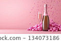 Festive background with Christmas and New Year. Bottle of champagne and sparkles pink background. Celebration banner concept. 134073186
