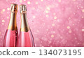 Festive background with Christmas and New Year. Bottle of champagne and sparkles pink background. Celebration banner concept. 134073195