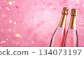 Festive background with Christmas and New Year. Bottle of champagne and sparkles pink background. Celebration banner concept. 134073197