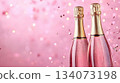 Festive background with Christmas and New Year. Bottle of champagne and sparkles pink background. Celebration banner concept. 134073198