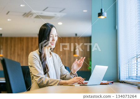 Business woman working in coworking space Business woman working in coworking space 134073264