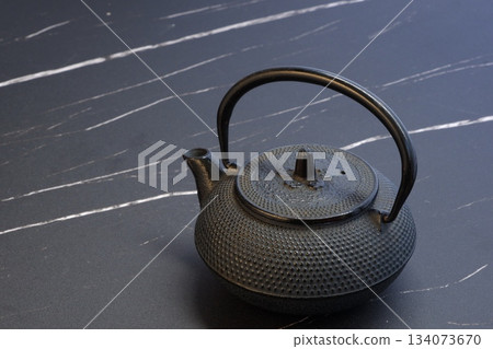 Iron kettle - A traditional Japanese iron kettle designed as a tea ceremony implement Iron kettle - A traditional Japanese iron kettle designed as a tea ceremony implement 134073670