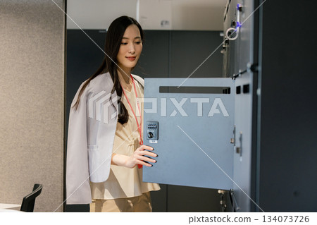 Woman putting hand on locker 134073726