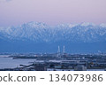 Sunset scenery overlooking Shinminato Bridge and the Tateyama mountain range 134073986