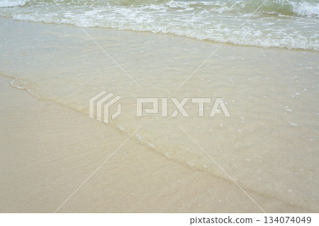 Waves crashing on a clear beach in Thailand Waves crashing on a clear beach in Thailand 134074049