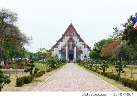 A road leading to a historic symmetrical building in Ayutthaya, Thailand A road leading to a historic symmetrical building in Ayutthaya, Thailand 134074064
