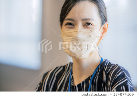 A woman wearing a mask 134074109