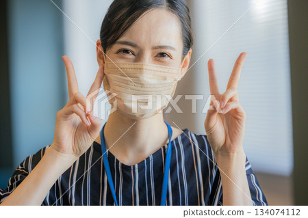 A woman wearing a mask A woman wearing a mask 134074112