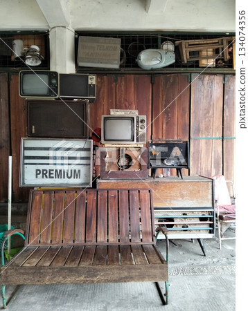 Rustic Display of Vintage Electronics and Wooden Bench 134074356