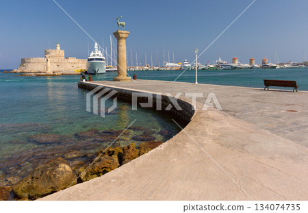 Fort Saint Nicholas at Mandraki harbor in Rhodes, Greece Fort Saint Nicholas at Mandraki harbor in Rhodes, Greece 134074735