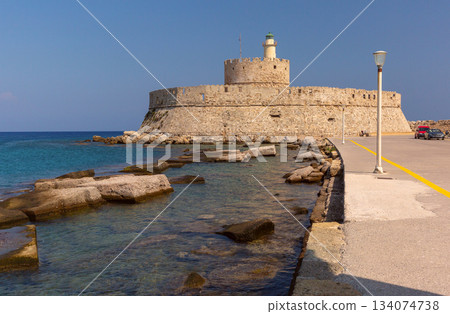 Fort Saint Nicholas at Mandraki harbor in Rhodes, Greece Fort Saint Nicholas at Mandraki harbor in Rhodes, Greece 134074738