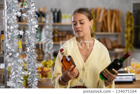 Woman choosing whiskey 134075104