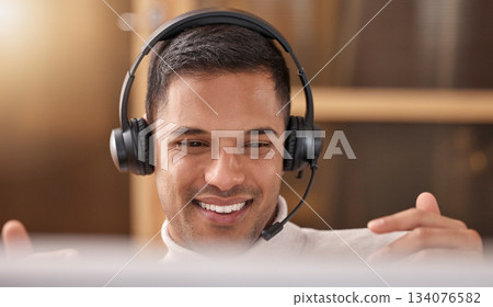 Call center, man and happy with smile on face at desk in office for sales and customer support, Male agent or consultant in telemarketing, support and crm with headphones for help desk communication Call center, man and happy with smile on face at desk in office for sales and customer support, Male agent or consultant in telemarketing, support and crm with headphones for help desk communication 134076582