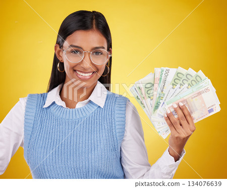 Studio cash money, portrait and woman smile for lottery prize, competition win or dollar bills award. Finance winner, payment or person winning poker, giveaway or casino gambling on yellow background 134076639