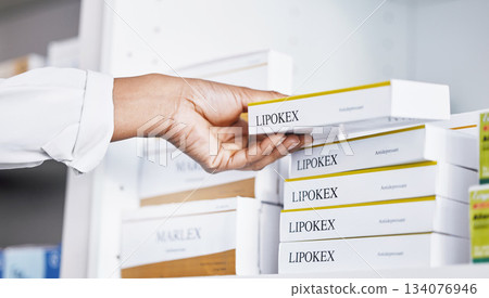 Doctor, hands and drugs from shelf for healthcare illness, pain or relief of medication at pharmacy. Hand of medical professional holding pharmaceutical products for inventory or packing at clinic 134076946