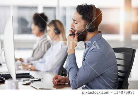 Tired, yawn and man call center agent doing an online consultation on a computer in the office. Burnout, customer service and bored male telemarketing consultant working on crm strategy in workplace. 134076955