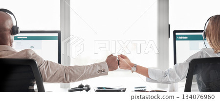 Business people, call center and fist bump for teamwork, collaboration or partnership in customer service at office. Back view of businessman or woman consultant agent touching hands in telemarketing Business people, call center and fist bump for teamwork, collaboration or partnership in customer service at office. Back view of businessman or woman consultant agent touching hands in telemarketing 134076960
