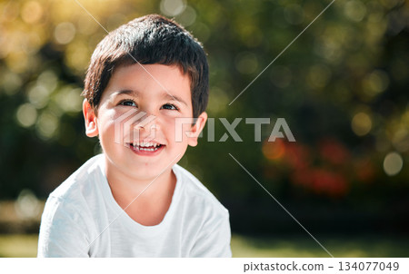 Children, thinking and mockup with a boy in a park or garden, alone outdoor during a summer day. Kids, idea and smile with a happy male child outside in nature for freedom on a blurred background Children, thinking and mockup with a boy in a park or garden, alone outdoor during a summer day. Kids, idea and smile with a happy male child outside in nature for freedom on a blurred background 134077049