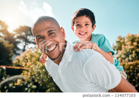Portrait, piggyback and a boy flying on the shoulders of his father outdoor in the garden while bonding together. Family, children or love and a son playing with his dad in the backyard of their home Portrait, piggyback and a boy flying on the shoulders of his father outdoor in the garden while bonding together. Family, children or love and a son playing with his dad in the backyard of their home 134077103